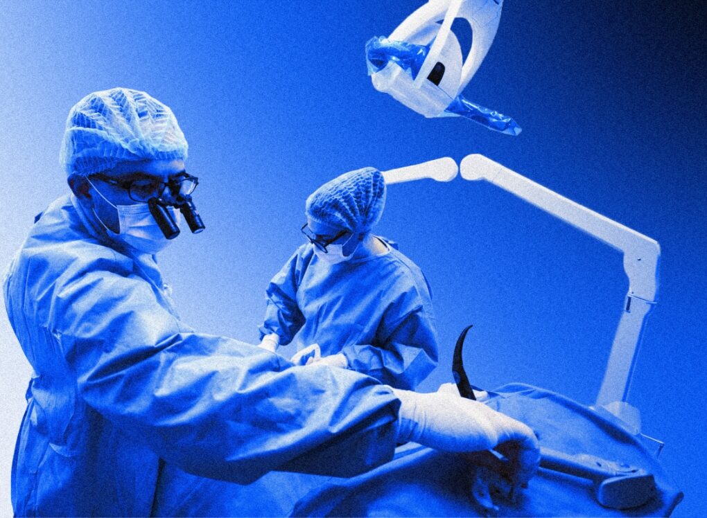 Clinicians treating a patient in surgery